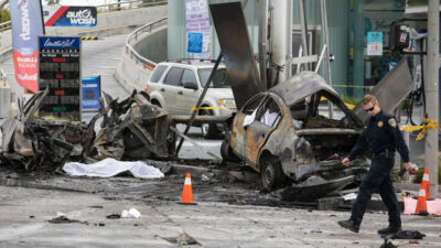 LOS ANGELES, CA - AUGUST 04: CHP and other officials investigate a fiery crash where multiple people were killed near a Windsor Hills gas station at the intersection of West Slauson and South La Brea
