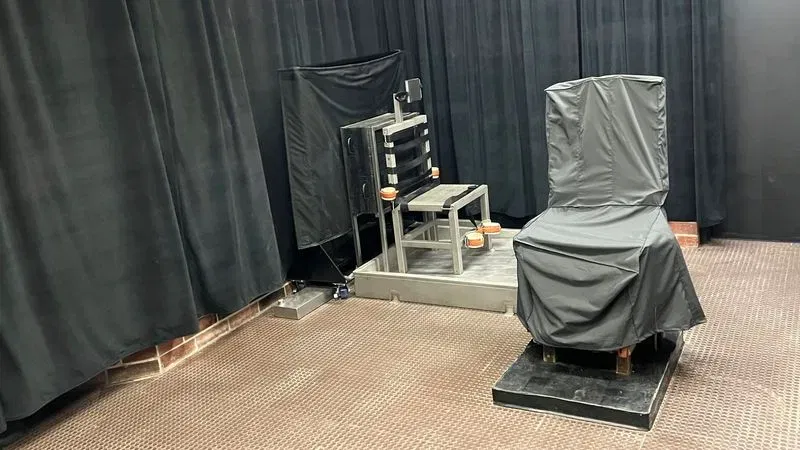 FILE - This photo provided by the South Carolina Department of Corrections shows the state's death chamber in Columbia, S.C., including the electric chair, right, and a firing squad chair, left. (Sout